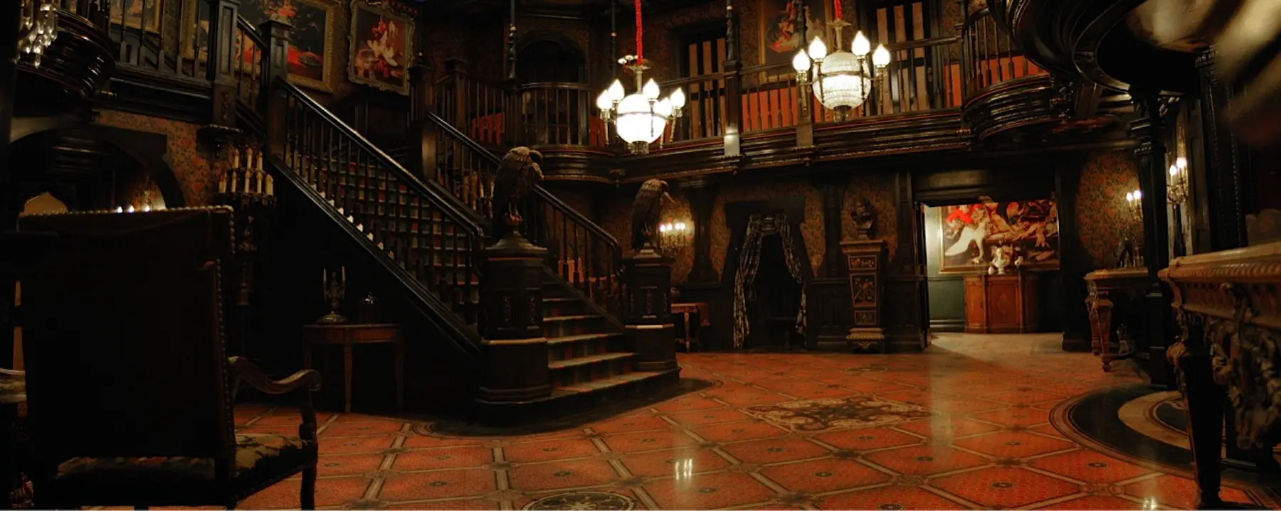 Grand staircase in dimly lit mansion