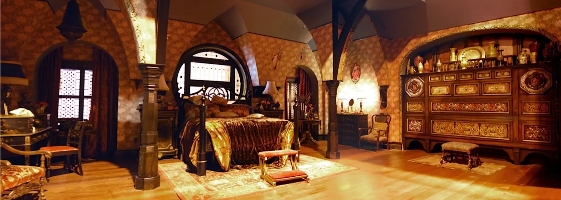 Ornate medieval bedroom with wooden furniture