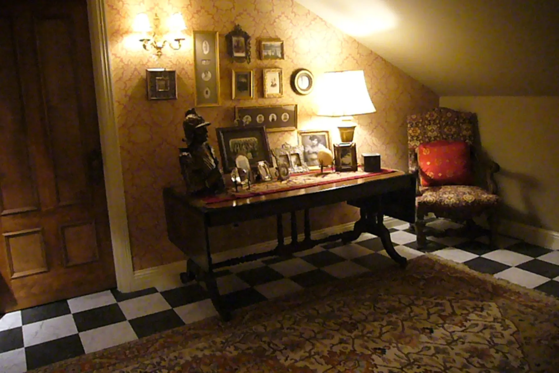 Cozy attic space with framed photos.