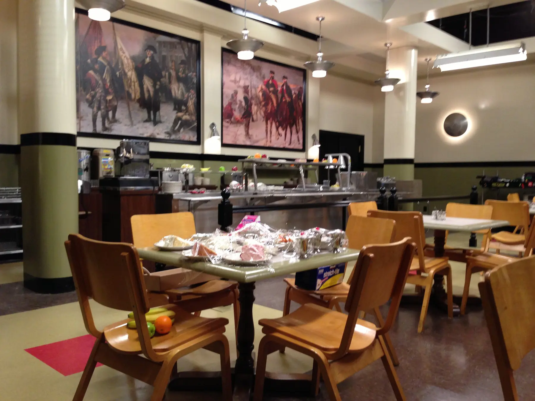 Empty dining area with historical paintings
