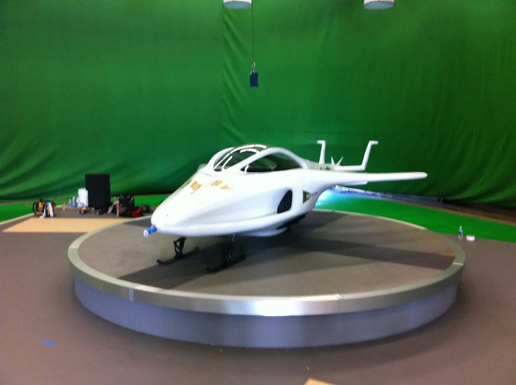 White aircraft model in green screen studio