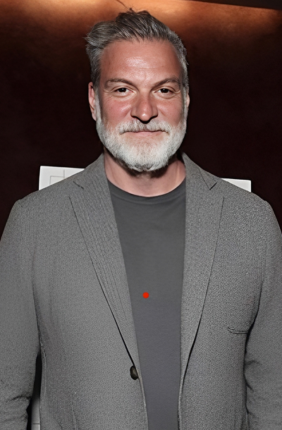 Man with gray beard smiling